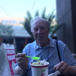 a man eating a bowl of ice cream