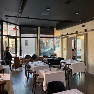 an empty restaurant with tables and chairs