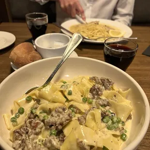 Sausage and pea pappardelle and veal Francese accompanied with Chianti wine