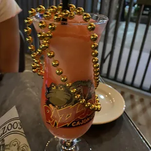 a pink drink with gold sprinkles