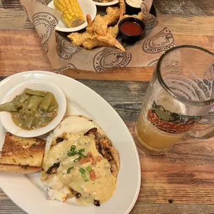 a plate of food and a glass of beer