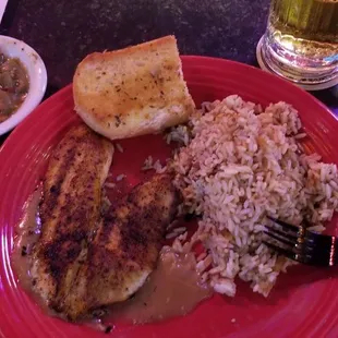 Tasteless tilapia, dirty rice with no seasoned ground beef and below average green beans.