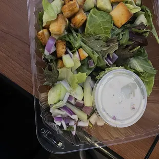 a salad in a plastic container