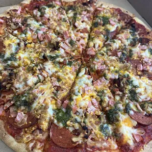 Vegan Sicilian, with vegan pepperoni, vegan bacon, roasted garlic, vegan pesto house made no nut &amp; vegan cheeses  ..