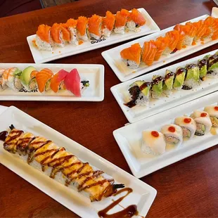 various types of sushi on plates