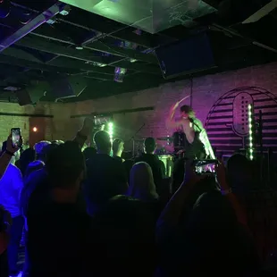a band performing in a dimly lit room