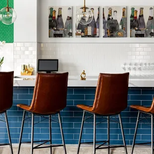 a row of leather bar stools