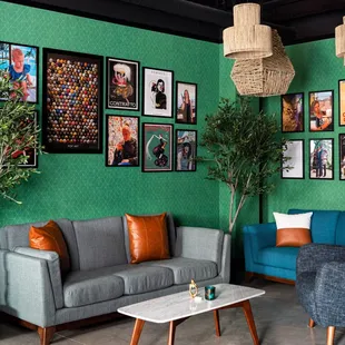 a living room with green walls