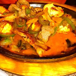 Chicken &amp; Steak Fajitas! It also comes with a huge plate of rice &amp; beans.