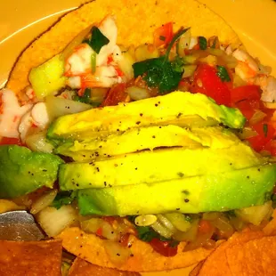 Shrimp Tostada topped with avocado. Everything is fresh. Good size for $5! I was satisfied!