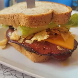 Schneeflock's Fried Balogna sandwich with a fresh side salad. Awesome.  Delicious. Super friendly service.