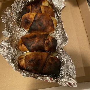 Burned pepperoni pizza roll, that was missing pepperoni inside too.