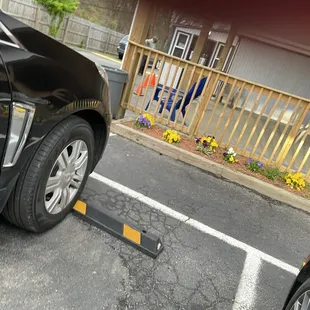 a black car parked in a parking lot