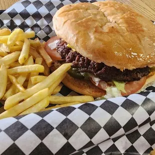Bacon cheese burger with jalapenos and fries combo.