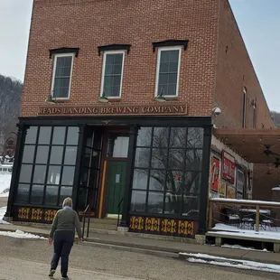 The wonderful historic building with a patio on the right side.