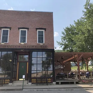 Historic building housed many other businesses, but nicely preserved with a modern pretty outdoor deck.