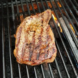a piece of steak on a grill