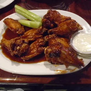 Chicken wings with dipping sauce.