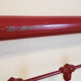 Mom's antique iron bed...painted with car paint. Scratched to the metal all over.