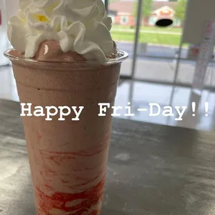 a smoothie with whipped cream on top