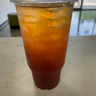 a cold drink in a plastic cup