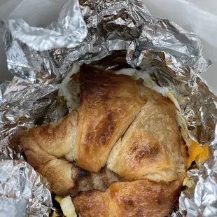 a croissant sandwich wrapped in foil