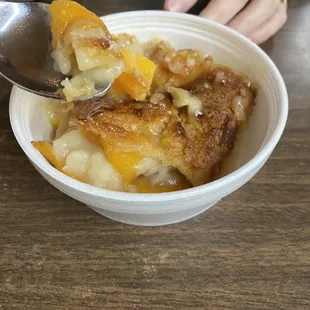 a bowl of food with a spoon in it