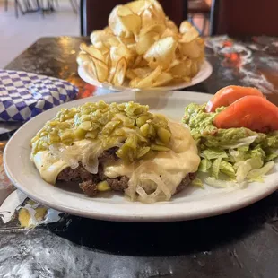 Patty melt with green chilis, and thinly fries