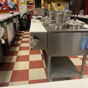 Pots of chili simmering.
