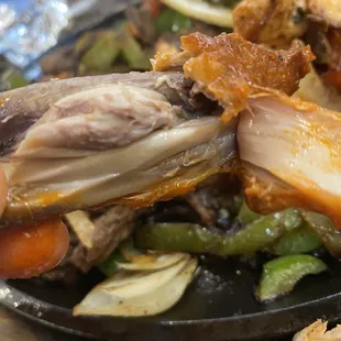 a plate of meat and vegetables
