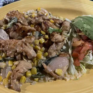 Pollo pablano - chicken and corn over rice with a pablano cream sauce.  Avocado on side.