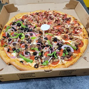 One half deluxe one half Butcher pizza