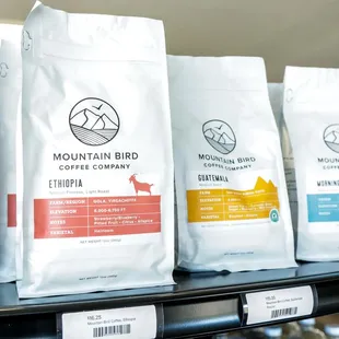 a variety of coffee bags on a shelf