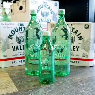 three bottles of mountain valley spring water