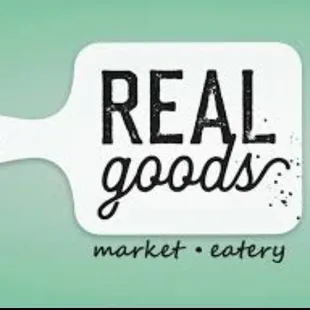 a cutting board with the words real goods
