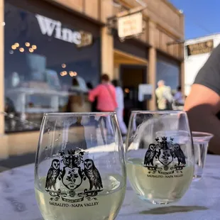 two glasses of wine on a table