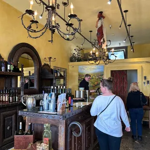 a woman standing at a bar
