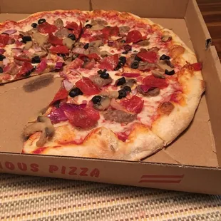 a whole pizza in a box