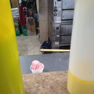 Contaminated food in a food prep area, currently being eaten by an employee.