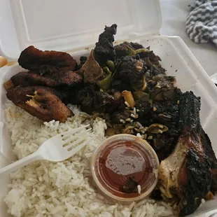 Oxtail combo jerk chicken with plantain and rice