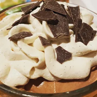 a chocolate mousse in a glass bowl