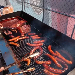 hot dogs on a grill