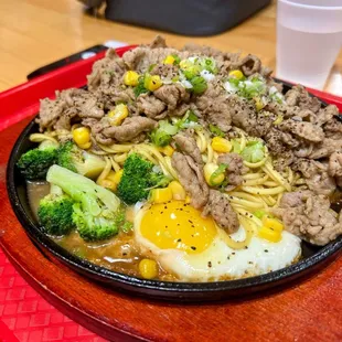 Teppanyaki pepper beef over noodles