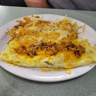 Bacon and Cheese omelet &amp; hashbrowns - also came with the biscuit $12.25.