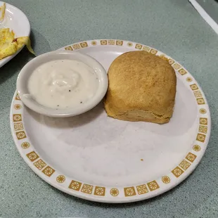 The side biscuit is presented with gravy and was so good!