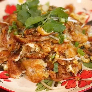 Crispy Fried Mussel Pancake( Hoy Tord)
 Mussel, green onion, bean sprout, and egg served with spicy homemade sauce.