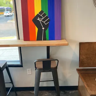 a table with a black fist painted on it