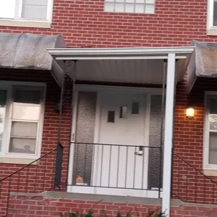 Crooked Porch and nasty looking awnings!!