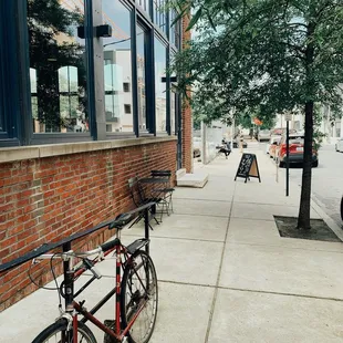 a bicycle parked on the sidewalk