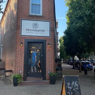 a woman walking down a sidewalk